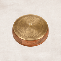 Brass masala dabba with engraved lid and wooden base