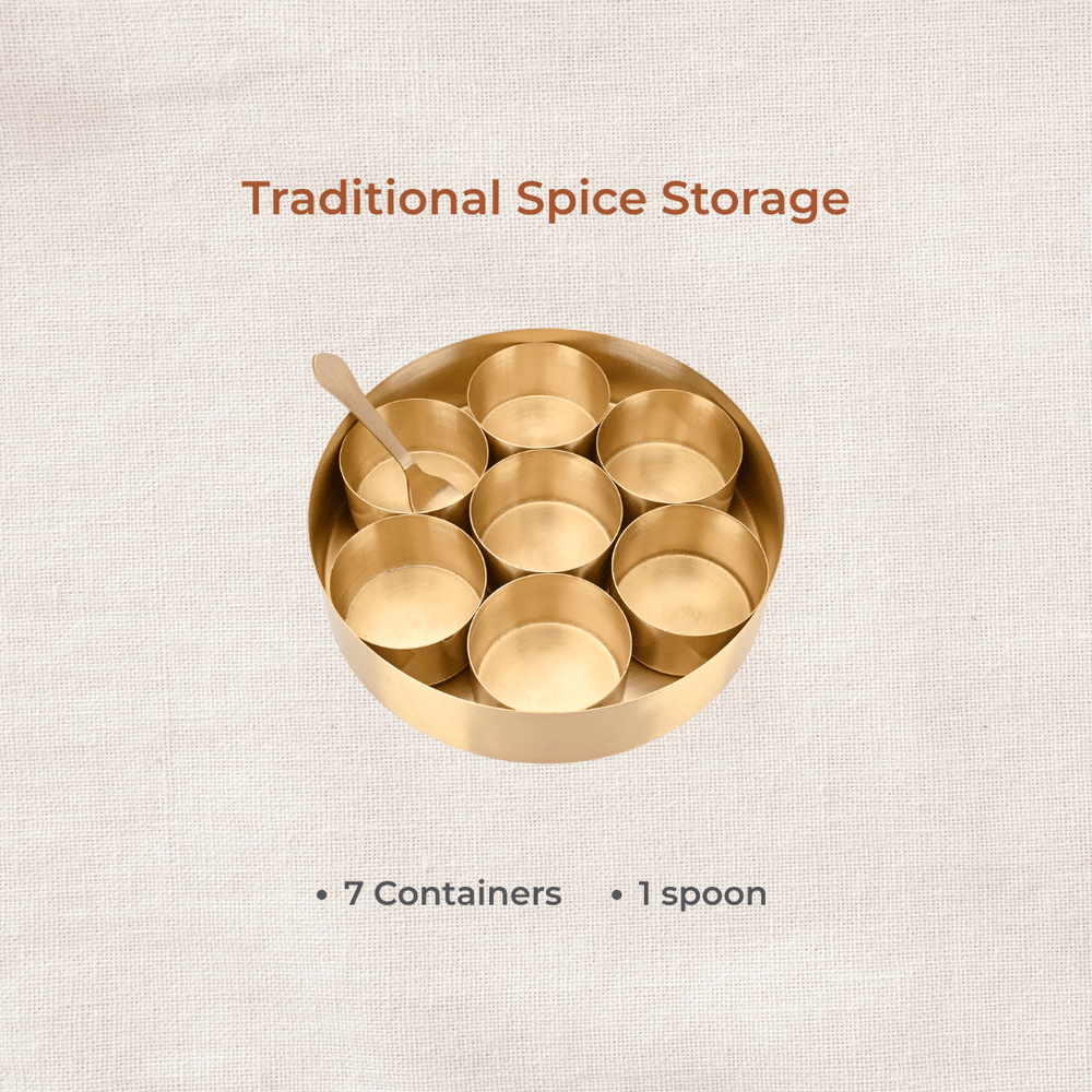 Brass masala dabba with seven empty spice containers top view