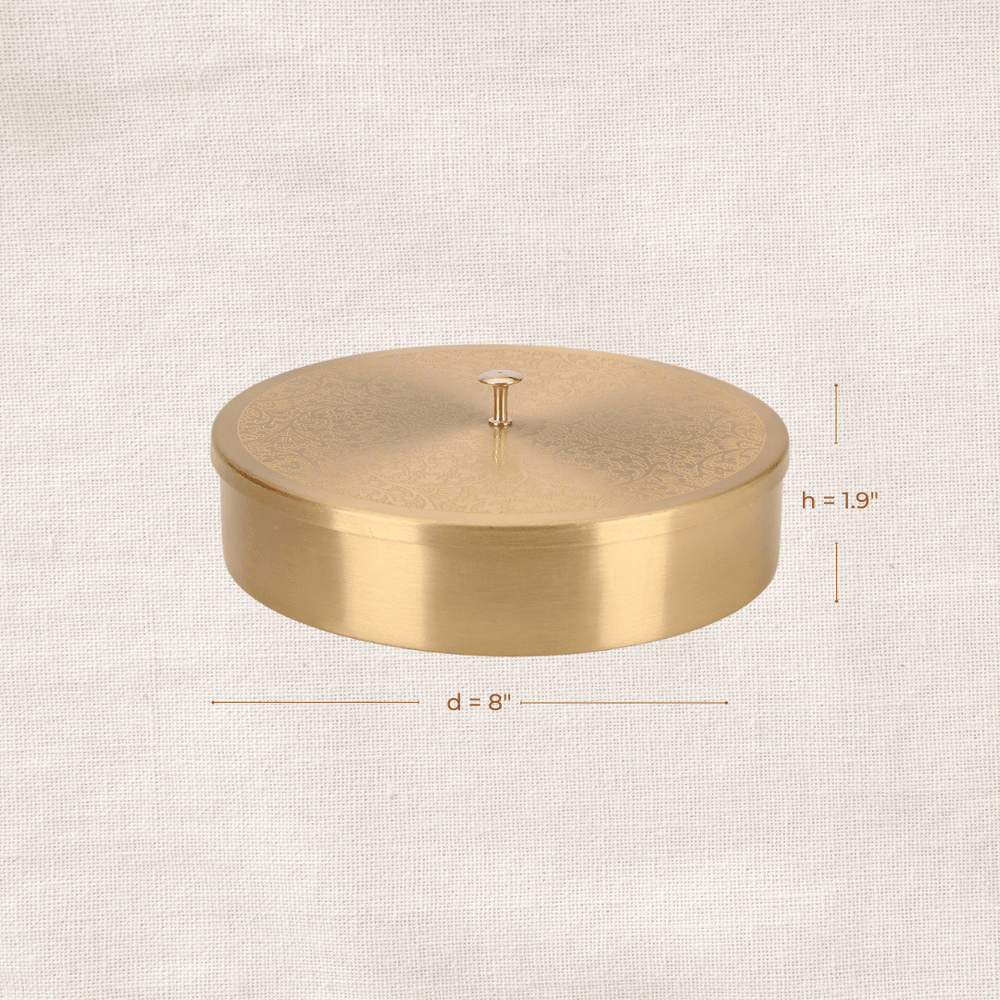 Side view of brass masala dabba showing height and diameter