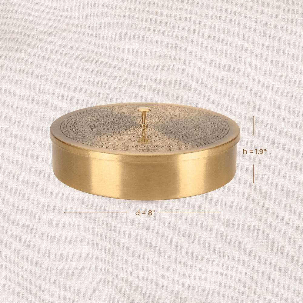 Side profile of a round brass masala dabba showing compact storage design and dimensions.