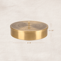 Side profile of a round brass masala dabba showing compact storage design and dimensions.