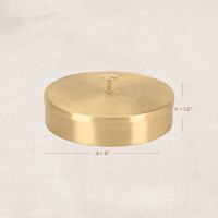 Side view of brass masala dabba showing height and diameter